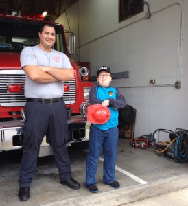 Bryan and the firefighter. Bryan's Christmas day his wish came true to be a policeman for the day.
